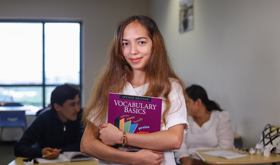 GLS student with her textbook